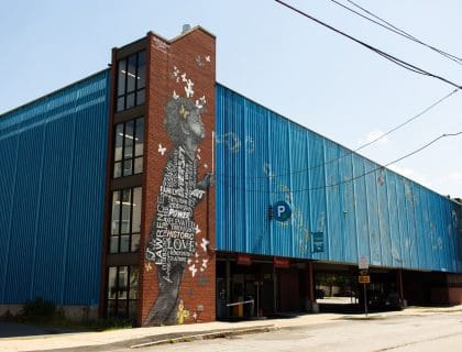 Mural of 4 Year Old Girl Blowing Bubbles on Buckley Transportation Center in Lawrence MA