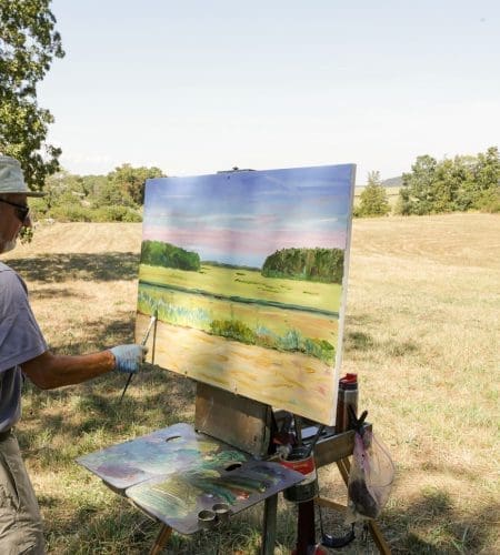 A painter painting - plein air - the marshes in Essex, MA