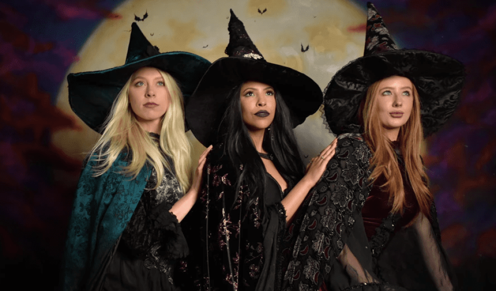 Three women dressed as witches at Witch Pix in Salem, Massachusetts