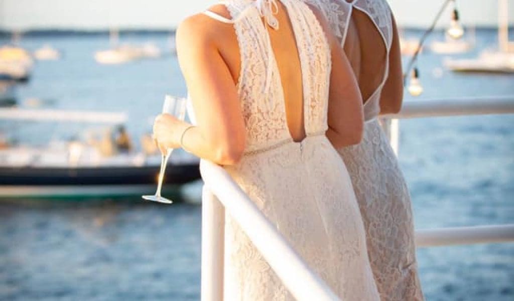 A couple posting on the Mahi Mahi boat on their wedding day