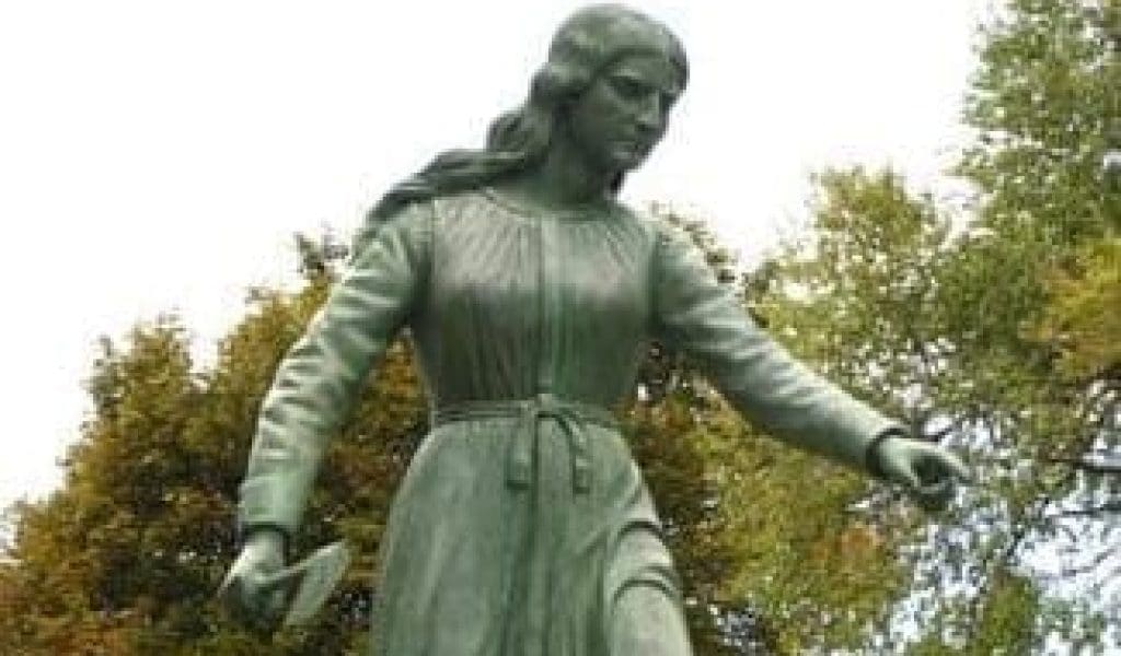 Close up image of the Hannah Duston Statue in Haverhill MA on a cloudy day.