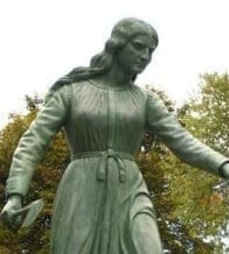 Close up image of the Hannah Duston Statue in Haverhill MA on a cloudy day.
