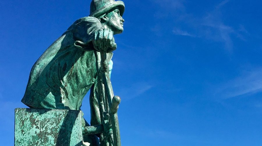 https://northofboston.org/wp-content/uploads/2024/07/Man-at-the-Wheel-side-view-of-Beauport-Hotel-by-Ann-Marie-Casey-3-e1721928178787.jpg